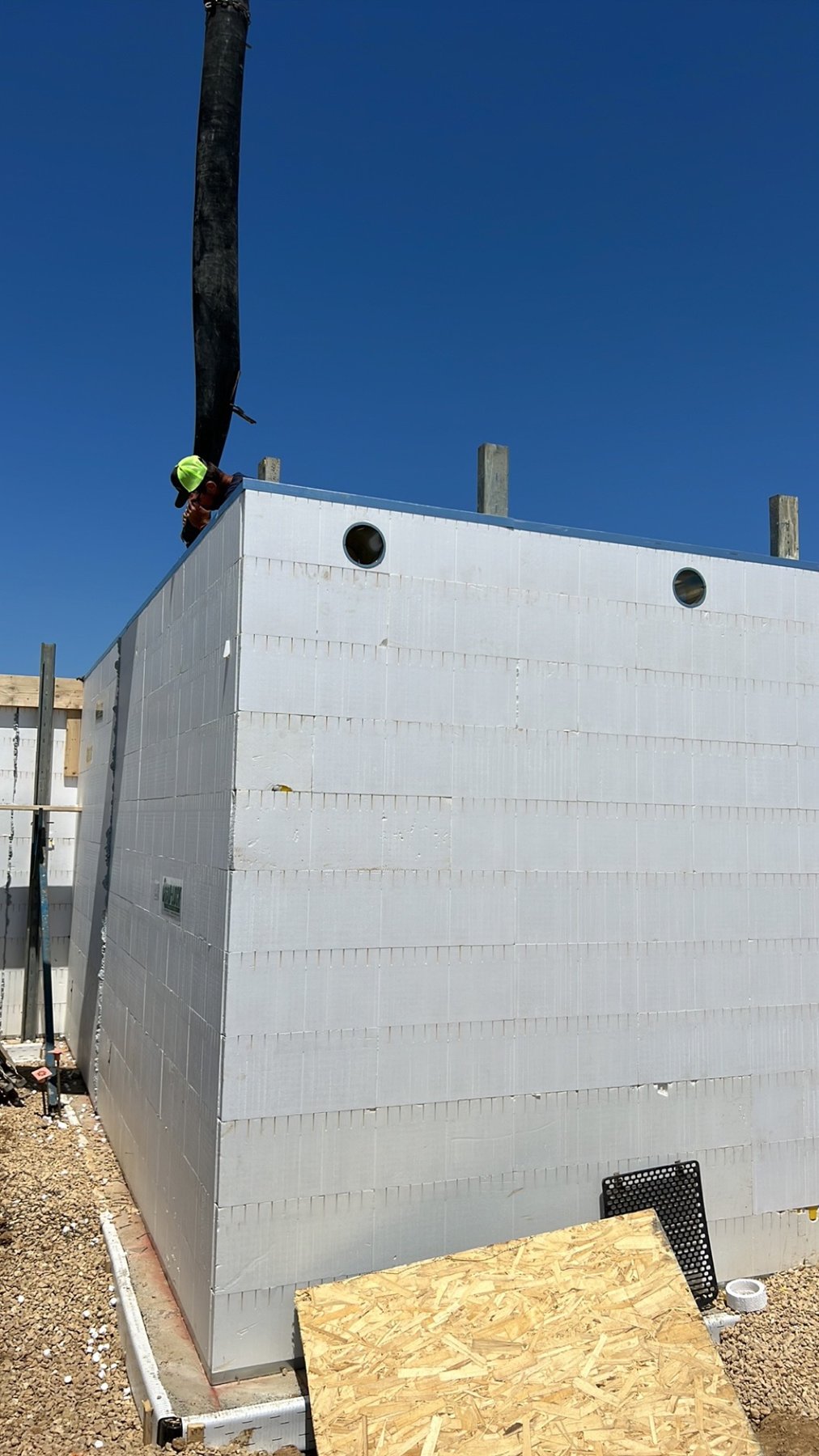 Concrete placement into an insulated concrete form wall